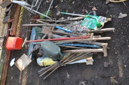 A QUANTITY OF GARDEN TOOLS including chimney sweep poles( no heads) a pick axe, forks, spades,