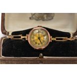 A LADYS 9CT GOLD WRISTWATCH, hand wound movement (non-running) round gold dial, Arabic numerals,