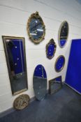 SIX VARIOUS FOLIATE FRAMED WALL MIRRORS, including gilt on plaster and giltwood mirrors, a cream