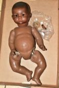 AN ARMAND MARSEILLE BLACK DREAM BABY DOLL bisque head with closed mouth, marked AM 341/8K, composite