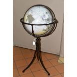 A MODERN GLOBE ON A METAL STAND, standing on three feet, dated 2008, total height approximately 83cm