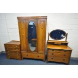 AN EARLY TO MID 20TH CENTURY OAK BEDROOM SUITE, comprising a single mirror door wardrobe, with a