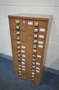 A METAL TWENTY EIGHT DRAWER FILING CABINET, some drawers with internal divisions, width 64cm x depth