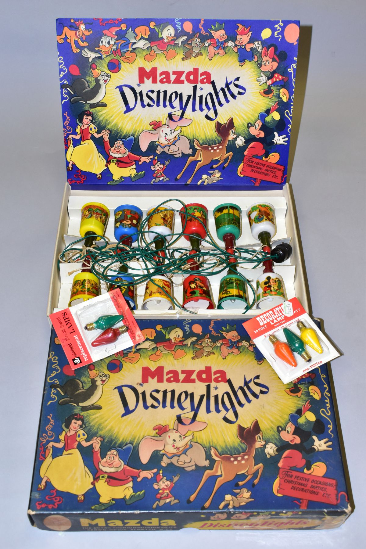 A BOXED SET OF VINTAGE BRITISH THOMSON-HOUSTON CO LTD 'MAZDA DISNEYLIGHTS', a strung set of twelve