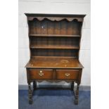 AN OAK DRESSER, with two drawers, on turned front legs, width 107cm x depth 46cm height 176cm (