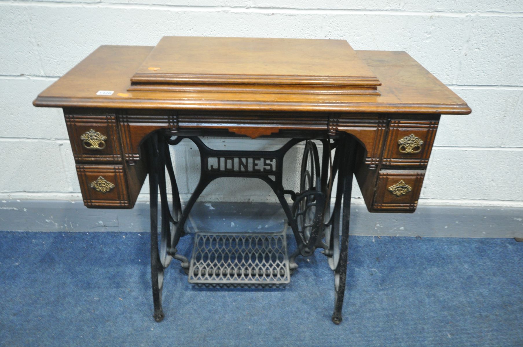 A VINTAGE JONES TREADLE SEWING MACHINE