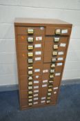 A METAL TWENTY EIGHT DRAWER FILING CABINET, some drawers with internal divisions, width 64cm x depth