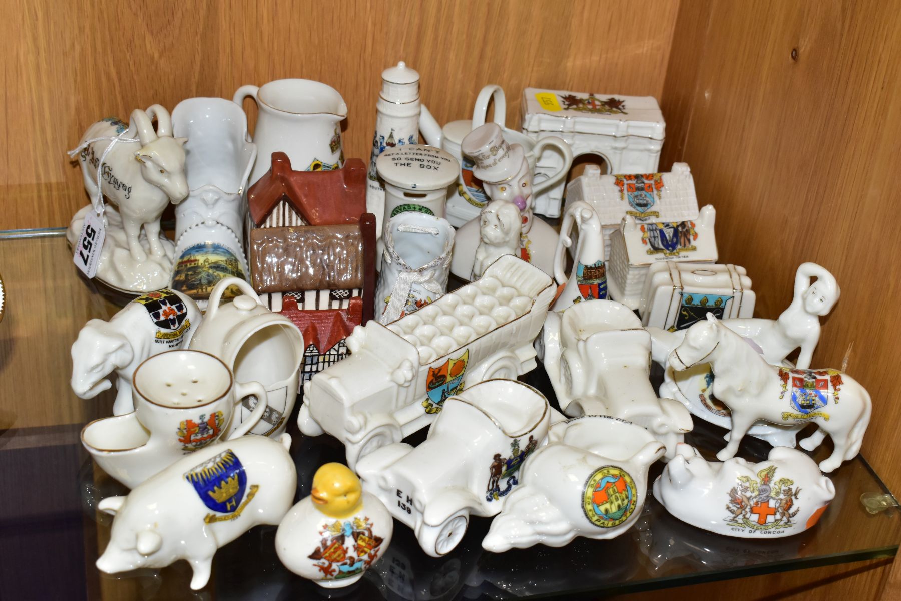 A GROUP OF CERAMIC CRESTED WARES, approximately twenty five pieces by different manufacturers, forms