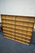 A PLYWOOD PIGEON HOLE SHELVING CABINET