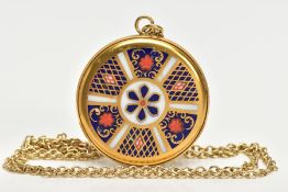 A ROYAL CROWN DERBY BONE CHINA PENDANT AND 9CT GOLD CHAIN, the gold-plated pendant of a circular