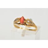 A 22CT GOLD GEM SET RING, set with a central oval cats eye chrysoberyl, six claw setting, flanked