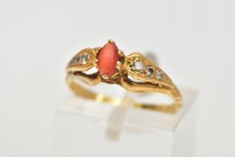 A 22CT GOLD GEM SET RING, set with a central oval cats eye chrysoberyl, six claw setting, flanked