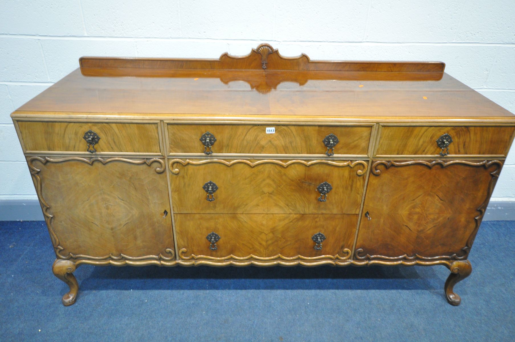 AN EARLY 20TH WALNUT QUEEN ANNE STYLE SIDEBOARD, with a raised back, an arrangement of drawers and