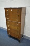 A TALL G PLAN TOLA AND BLACK AFROMOSIA CHEST OF SEVEN DRAWERS, width 61cm x depth 41cm x height