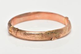 A 9CT GOLD BANGLE, an AF hinged hollow domed bangle with scrolling foliage detail, approximate width