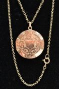 A LOCKET PENDANT NECKLACE, the gold front and back locket of a circular form, decorated with a