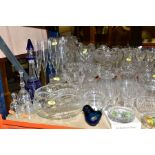 A QUANTITY OF GLASSWARE, MOSTLY CLEAR DRINKING GLASSES, including a Wedgwood Glass bird paperweight,