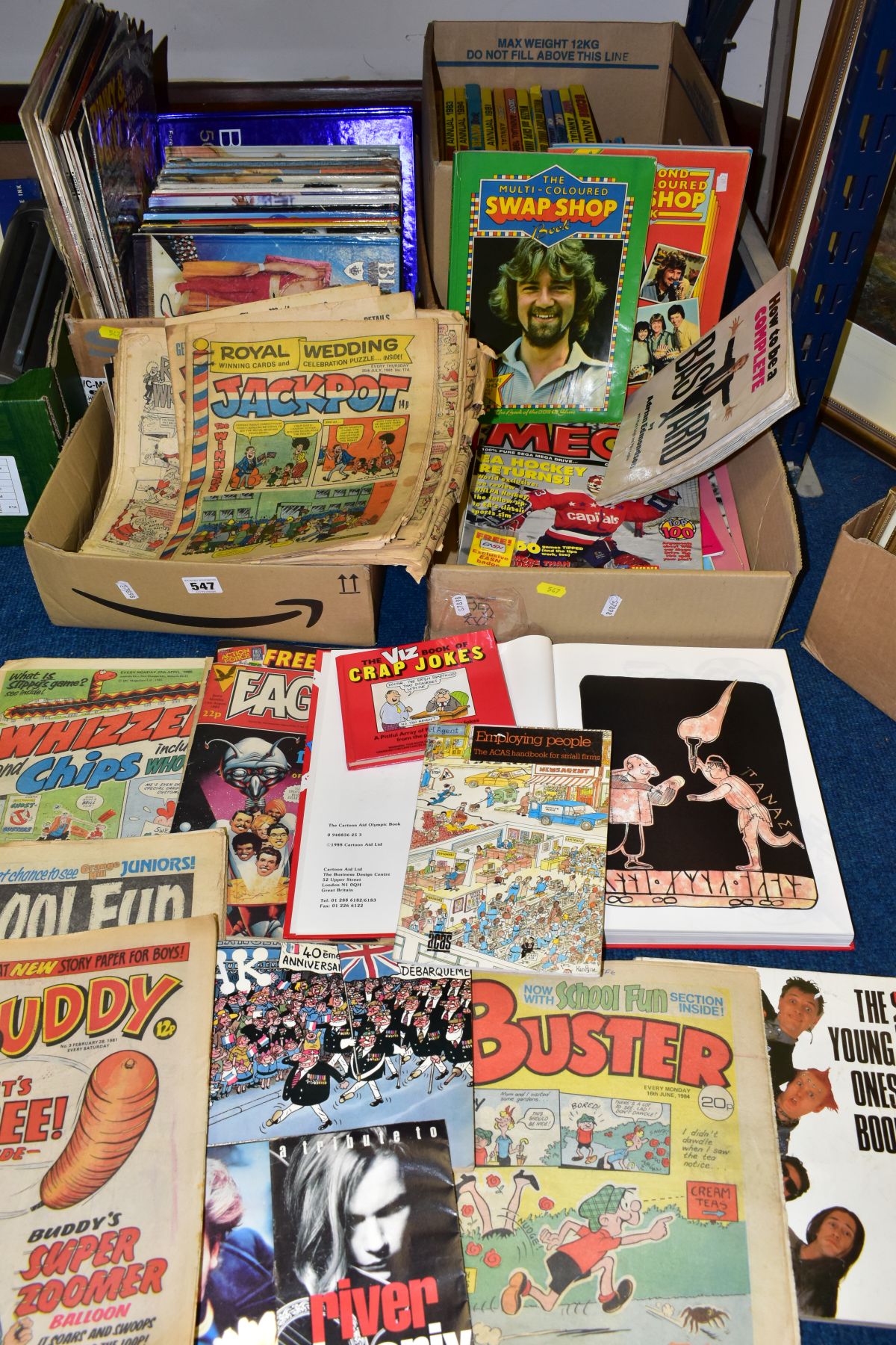 FOUR BOXES OF BOOKS, COMICS AND RECORDS, to include over forty 1970s and 1980s annuals, Blue