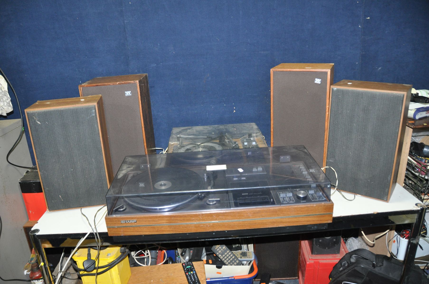 A VINTAGE SHARP SG-315E MUSIC CENTRE with a pair of CP315E speakers (working apart from tape