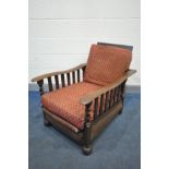 AN ARTS AND CRAFTS OAK RECLINING CHAIR