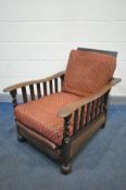 AN ARTS AND CRAFTS OAK RECLINING CHAIR