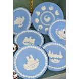 ELEVEN WEDGWOOD PALE BLUE JASPERWARE CHRISTMAS PLATES, comprising a tenth anniversary 1969-1978