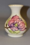 A LARGE MOORCROFT POTTERY BULBOUS VASE, with flared neck, decorated with tubelined pink Magnolia