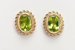 A PAIR OF 9CT GOLD PERIDOT EARRINGS, oval cut peridot bezel set in yellow gold and a rope twist