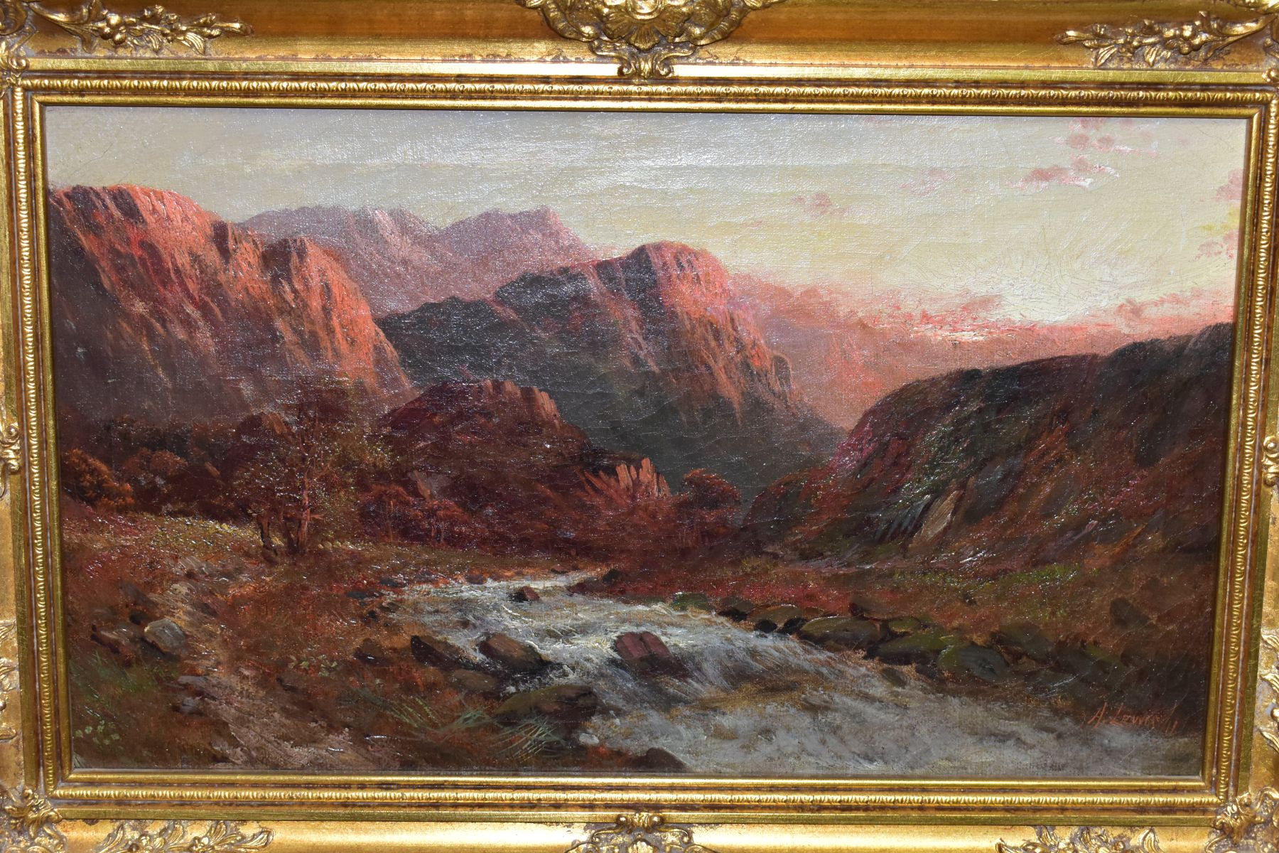 A. LEWIS (19TH/20TH CENTURY) A MOUNTAINOUS LANDSCAPE AT SUNRISE, fast flowing stream to the - Image 2 of 6