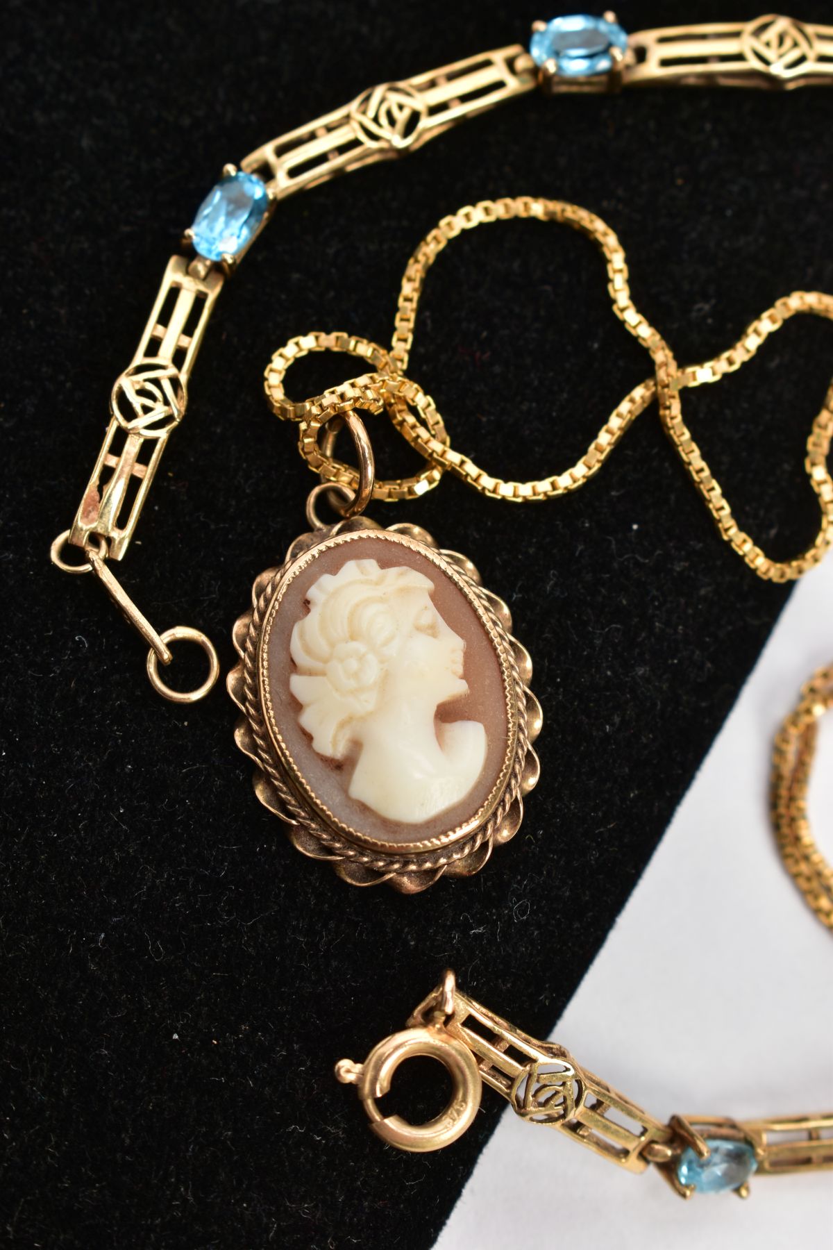 A 9CT GOLD TOPAZ BRACELET AND CAMEO NECKLACE, nine oval cut blue topaz stones interspaced between - Image 2 of 3