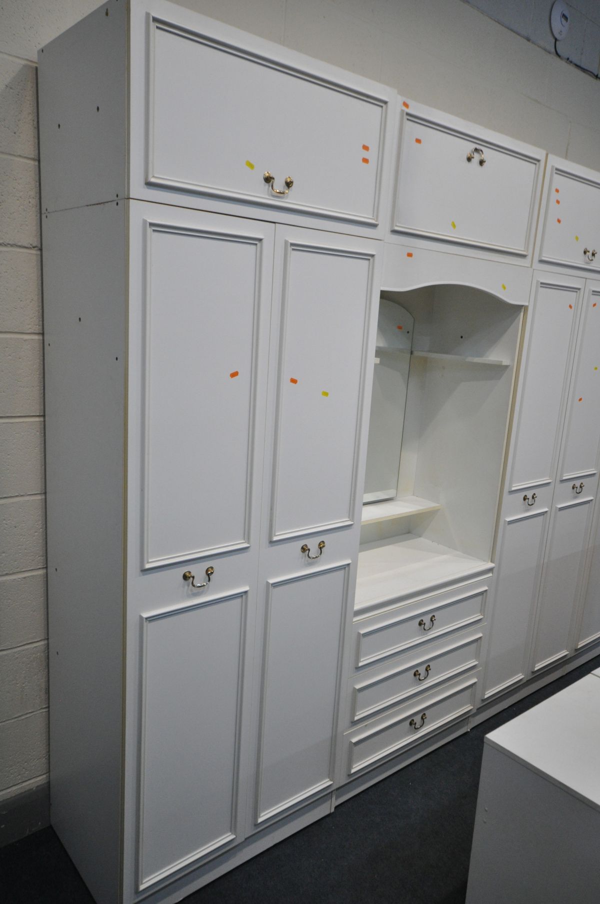 A WHITE BEDROOM SUITE, comprising a five section wardrobe fitment with top storage sections, a chest - Image 4 of 4