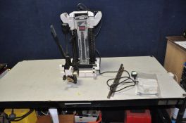 A RYOBI CM-31 CHAIN MORTICER fitted with a 16mm chain, manual and original box (PAT pass and