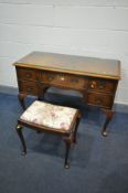 A 20TH CENTURY WALNUT DRESSING TABLE, with five drawers, on cabriole legs, width 114cm x depth