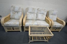 A WICKER FOUR PIECE WICKER CONSERVATORY SUITE, comprising a settee, pair of armchair and a coffee