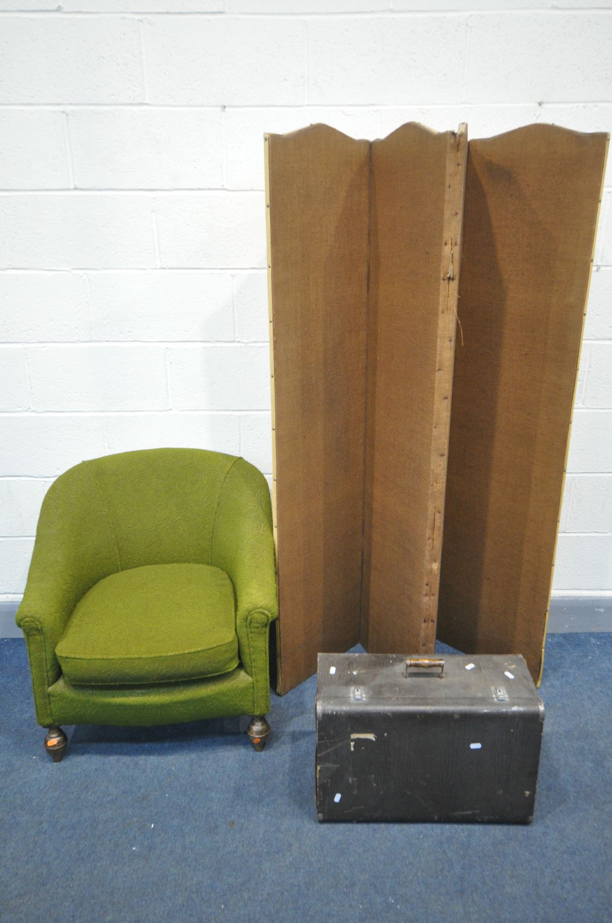 AN EARLY 20TH CENTURY TUB CHAIR with green upholstery, along with a folding floor standing screen