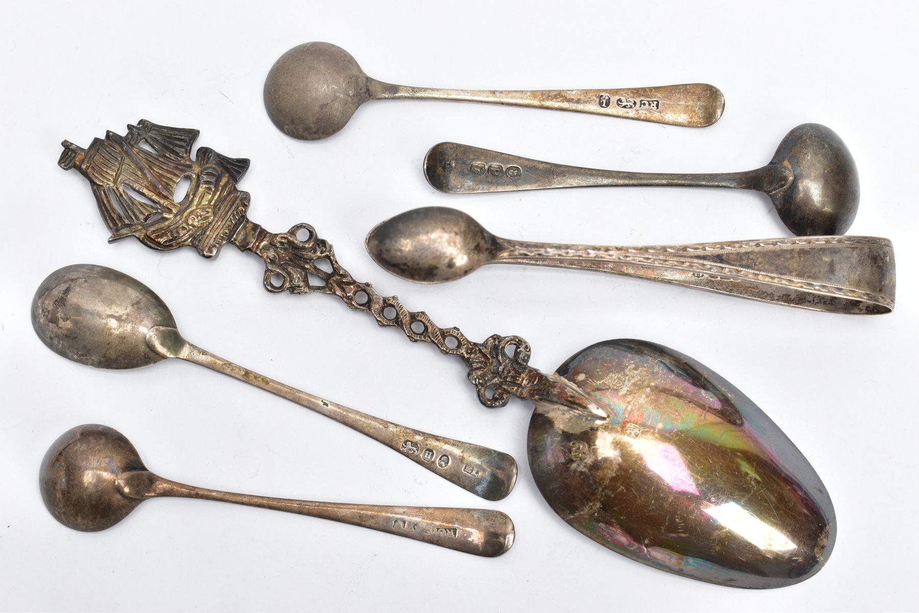 A BAG OF SILVER AND WHITE METAL SPOONS AND A PAIR OF SUGAR TONGS, to include four Georgian old - Image 3 of 4