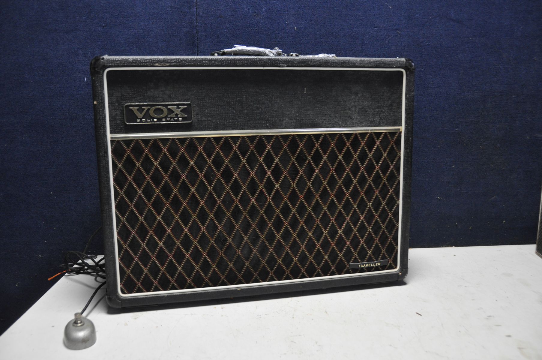 A VOX TRAVELLER GUITAR AMPLIFIER with some damage to carry handle (PAT pass and powers up but