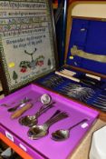 A BOX AND CANTEEN OF CUTLERY, AND A NEEDLEWORK SAMPLER, to include a wooden canteen of twenty two