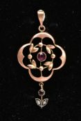 AN EARLY 20TH CENTURY FLORAL PENDANT, a circular cut amethyst in a milgrain setting, central to an