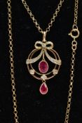 A MODERN 9CT GOLD RUBY AND DIAMOND PENDANT NECKLACE, openwork circular pendant with a diamond