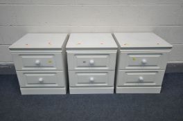 THREE WHITE FINISH TWO DRAWER BEDSIDE CABINETS