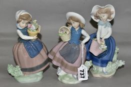 THREE LLADRO FIGURINES, comprising Sweet Scent 5221, Pretty Pickings 5222 and Spring is Here 5223,
