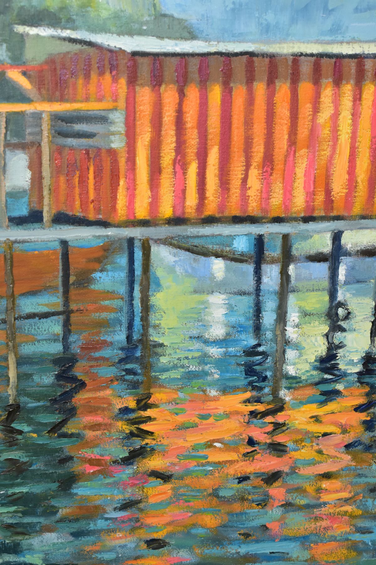 G CADBURY (20TH CENTURY), A COLOURFUL BUILDING ON A PIER OVER WATER, signed bottom right, oil on - Image 2 of 3