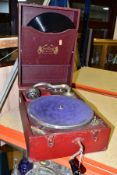 A RED CASED SAVANA ELECTRIC PORTABLE GRAMOPHONE, with winding handle but mechanism not working,