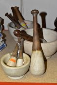 A GROUP OF VINTAGE PESTLE AND MORTARS, comprising three mortars diameters 12.5cm, 20cm and 23.5cm