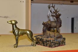 A METAL FIGURE GROUP OF A STAG AND A DOE, AND A BRASS GREYHOUND, comprising painted deer figures