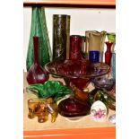 A GROUP OF COLOURED GLASS WARES, approximately twenty four pieces to include a pink Caithness