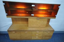A MID-CENTURY TEAK DISPLAY/WALL CABINET, with two smoked glass double cupboard doors, width 163cm