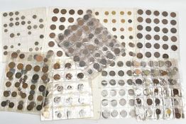 A QUANTITY OF SHEETED UK AND WORLD COINAGE, to include amounts of coins containing silver