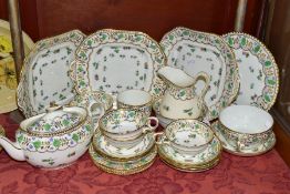 A THOMAS GOODE TEA SET, twenty six pieces with a handpainted gilt floral and foliate decoration,